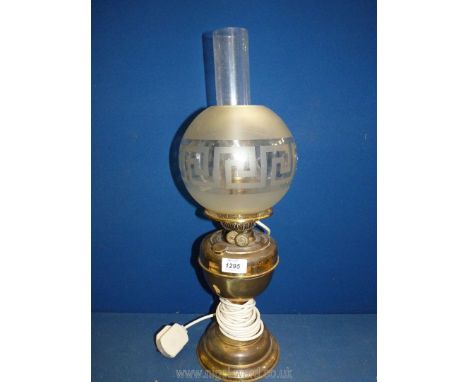 An Oil lamp converted to electric with brass base, chimney and globe glass shade with Greek key design, 21 1/2" tall.