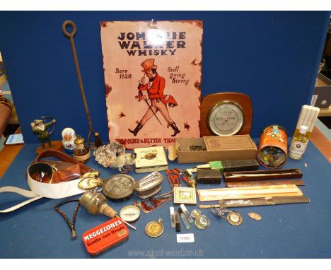 A box of miscellanea to include barometer, cased cut throat razor, Ronson table lighter, Las Vegas dollar, mini Guinness bott