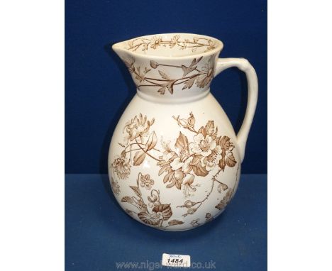 A vintage jug, cream with brown flowers, 10 1/2" tall.
