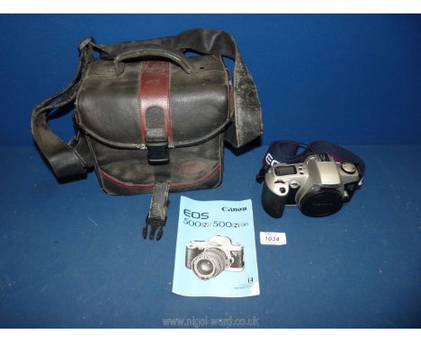 A Canon EOS 500N 35mm auto focus SLR Camera Body with instruction manual, original Lanyard, and gadget case.