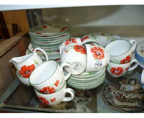 A Royal Worcester 'Poppies' part tea and dinner set to include; 8 cups, 7 saucers, 6 bowls, 9 tea plates, cream jug, sugar bo