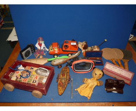 A quantity of vintage toys including; Chad Valley 'Sooty' glove puppet, tinplate helicopter and paddle steamer, etc.