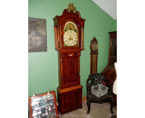 An impressive and most substantial Mahogany and other woods Long-case Clock having an arched painted face with rolling moon t