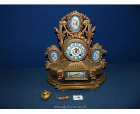 An Ormolu/gilded metal cased mantle Clock, having a domed porcelain face with a central reserve beautifully decorated with a 