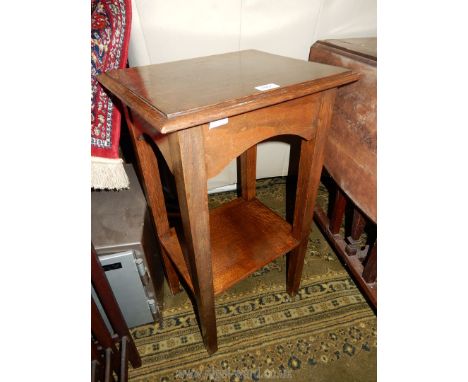 A heavy dark Oak occasional/lamp table standing on tapering square legs united by a lower shelf, 16 1/4'' x 13 7/8'' x 28'' h