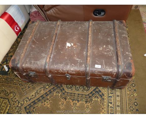 An old Stardex travel trunk, canvas with leather corners and handles, separate shelf inside, 36" x 22".