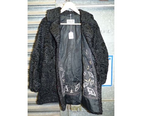 A vintage 1960's classic black curly lambs fur Coat/jacket with embroidered detail to lining by Dobos furs Cardiff.   **
