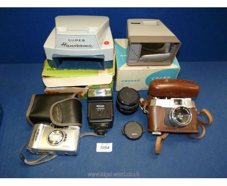 A cased Halina 35X super 35m film camera, Praktica power zoom 36m film camera, Photax solar colour viewer, a Hanimex super Pa