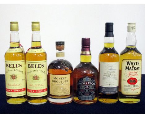 2 75-cl bts Bells Extra Special Old Scotch Whisky 40% ind oc 1 70-cl bt Chivas Regal 12 YO Blended Scotch Whisky 40% 1 70-cl 