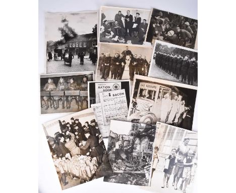 PRESS PHOTOGRAPHY, Second World War. A group of approximately 58 black and white photographs relating to the the Home Front a