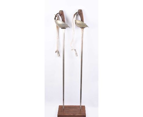 Two P1908 Cavalry Troopers or Yeomanry swords, with white sword knots, with War Department arrows and various inspection mark