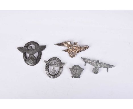 Germany, Third Reich. A Reichsluftschutzbund (RLB) badge, Army (Heer) Visor Cap eagle, zinc Police eagle badge (lacking prong
