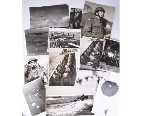 PRESS PHOTOGRAPHS. Second World War, including several Airborne Troops, Paratroopers and Marines, circa 1941-45. Thirty-two p