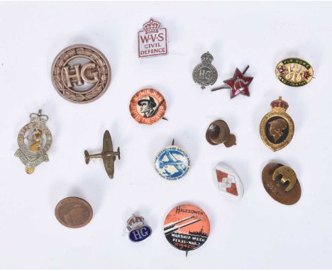 A small collection of badges, including Home Guard, WVS, National Volunteer Reserve VTC, Railway Service, Hitler Youth and ot