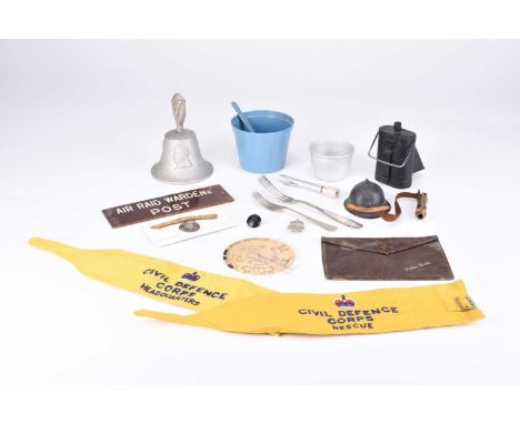 A collection of assorted militaria, comprising Post &amp; Cold War: Emergency feeding cup and spoon, Civil Defence Corps Head