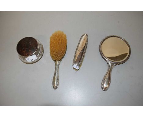 Silver backed three piece dressing table set together with a further dressing table jar (4)