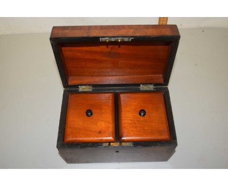 A Victorian walnut veneered tea caddy with two section interior