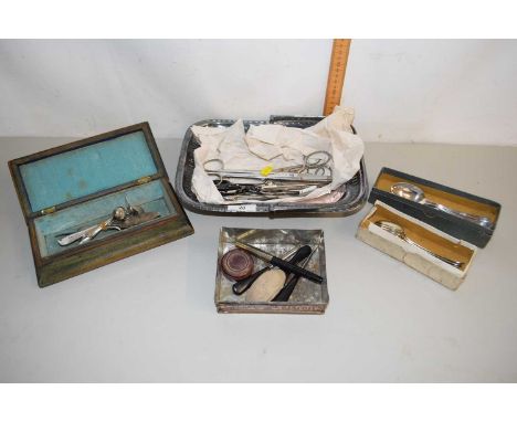 A silver plated table basket together with cases of assorted cutlery and other items