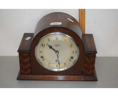 An oak cased mantel clock, the face signed Bullen, Norwich