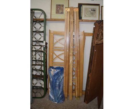 A modern light wood single bed frame