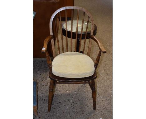 An elm seated stick back carver chair
