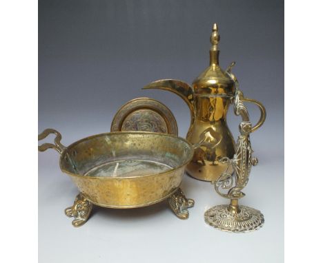 AN ISLAMIC BRASS COFFEE POT, having impressed makers marks to body, H 35 cm, together with a selection of brassware comprisin