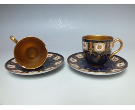 ROYAL WORCESTER BLUE AND GILT CUP AND SAUCER, early 20th century, blue ground with interior gilding, having enamel and gilt d
