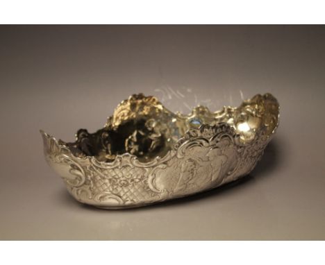 A HALLMARKED CONTINENTAL SILVER BOWL, having vignettes of a winged cherub teaching a dog tricks to one side and another playi