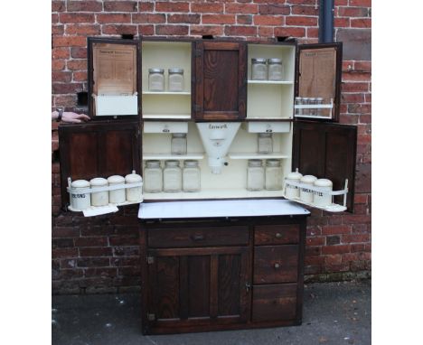 AN EARLY TO MID 20TH CENTURY 'EASIWORK' OAK KITCHEN CABINET WITH ENAMEL WORKTOP, the upper panelled cupboards with integral f