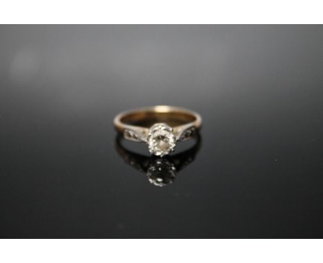 AN 18CT AND PLATINUM DIAMOND SOLITAIRE RING, set with a brilliant cut diamond of approx 0.20 carat, ring size N