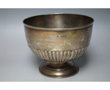 A HALLMARKED SILVER FOOTED BOWL BY WILLIAM HUTTON AND SONS LTD - LONDON 1895, having typical half fluted engraving, approx we