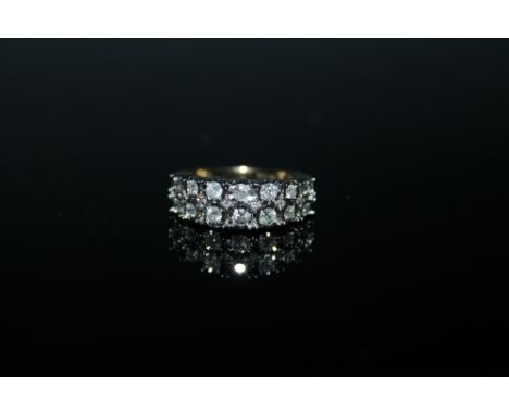 A DOUBLE ROW DIAMOND HALF ETERNITY RING, having brilliant cut diamonds totalling approximately half a carat illusion set in h