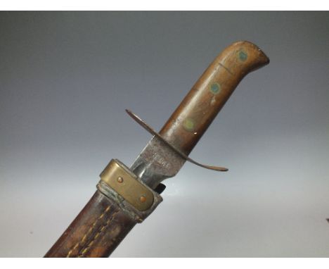A DUTCH HEMBRUG KLEEWANG SHORT SWORD, having curved single fullered blade stamped Hembrug, complete with brass mounted leathe