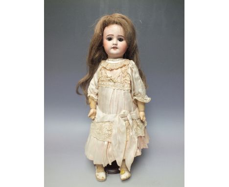 AN SFBJ  JUMEAU BISQUE HEADED DOLL, impressed marks to back of head, sleeping eyes, composite jointed body, H 47 cm