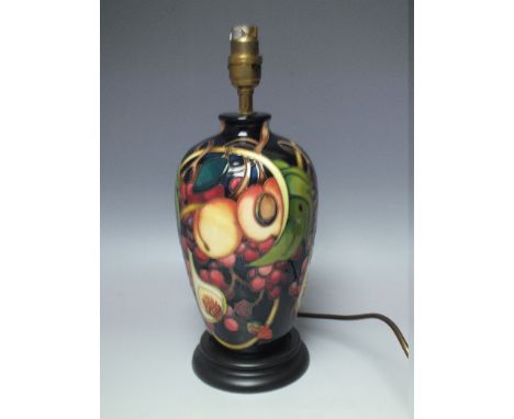 A MOORCROFT 'QUEENS CHOICE' TABLE LAMP. with typical tubelined decoration, overall H 33 cm (inc. fitment), with shade
