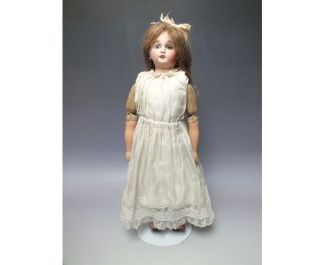 AN A & L LIMOGES BISQUE HEADED DOLL, impressed marks to back of head 'AL&Co. Limoges, France', composite and textile jointed 