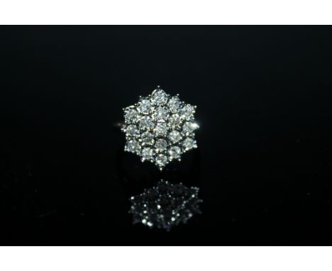 A 1 CARAT DIAMOND CLUSTER RING, having a cluster of brilliant cut diamonds illusion set in 9 carat yellow gold, ring size O