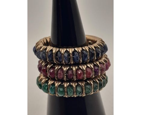 3 MOON-LIGHT WEDDING RINGS IN 9K BURNISHED GOLD WITH RUBIES, EMERALDS AND SAPPHIRES. (ONE RUBY IS MISSING IN THE RED FAITH). 