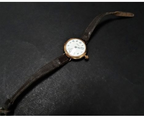 An early 20th century 9ct. hallmarked rose gold Waltham lug manual wind wristwatch, the 24mm white enamel dial with Arabic nu