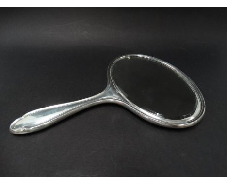 A George V silver engine turned hand mirror, Birmingham 1930, length 25cm.