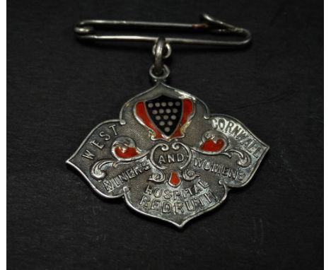 A George V silver and enamel nurse's medallion inscribed 'WEST CORNWALL MINORS AND WOMEN'S HOSPITAL REDRUTH', the back with i