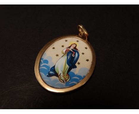 An 18ct. gold mounted (tested) oval pendant set with enamel on metal depiction of St. Maria, inscription to the back, length 
