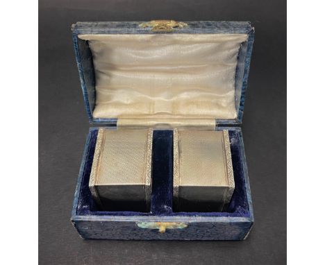 A pair of George VI heavy engine turned square section napkin rings within fitted case, maker T &amp; S, Birmingham 1936, wei