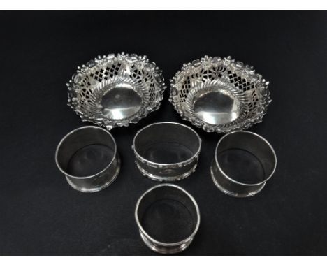 A pair of Victorian silver bonbon dishes, foliate embossed and pierced, maker M.Bros, Birmingham 1876, diameter 8.5cm (both A