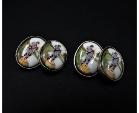 A pair of 925 silver and coloured enamel anglers cufflinks, each oval set with a coloured enamel painted fisherman in a river