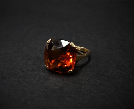 A modern 9ct. gold fire opal set dress ring, the cut stone of cushion shape, measuring 14 x 14mm, size M, weight 4.5g approx.