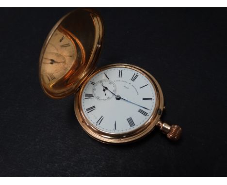 An 18ct. hallmarked gold full hunter crown wind pocket watch, the 32mm white enamel dial with subsidiary seconds dial and Rom