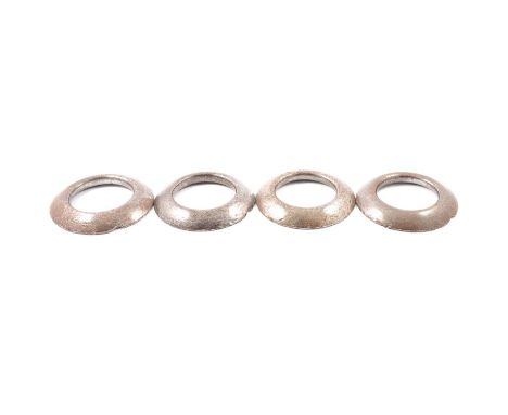 Set of four steel quoits, probably 19th century, each of ring form stamped 4lb, outer diameter 14cm.
