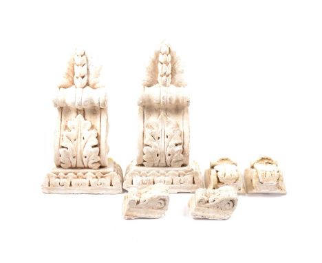 Three pairs of plaster cast architectural mounts, the largest 38cm high, and a number of gilt metal railing finials.