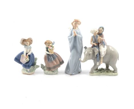 Lladro Hindu Children 5352; Pretty Pickings 5222; Spring Is Here 5223; and Nao Girl Praying 298, with box.